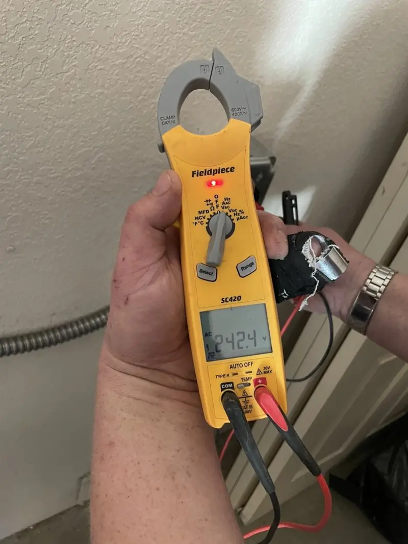 Voltage testing with clamp meter during Generator Installation in Montgomery